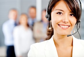 Female customer support operator with headset and smiling Female customer support operator with headset and smiling