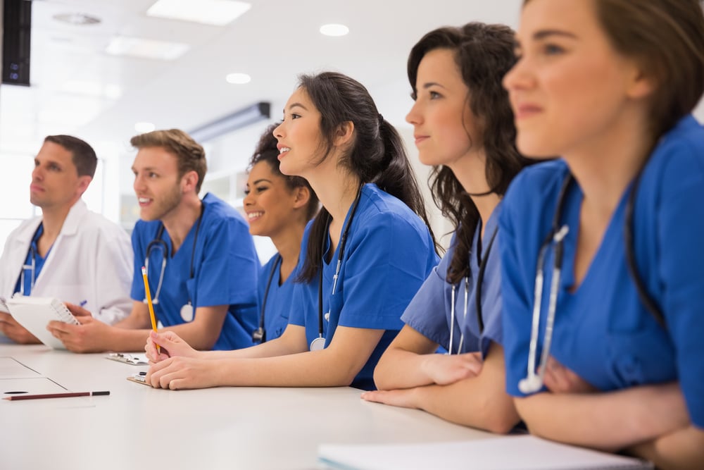 Medical student group in a classroom listening to an ultrasound lecture Medical student group in a classroom listening to an ultrasound lecture
