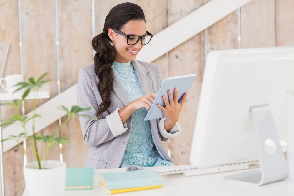 Stylish brunette working from home in her home office Stylish brunette working from home in her home office